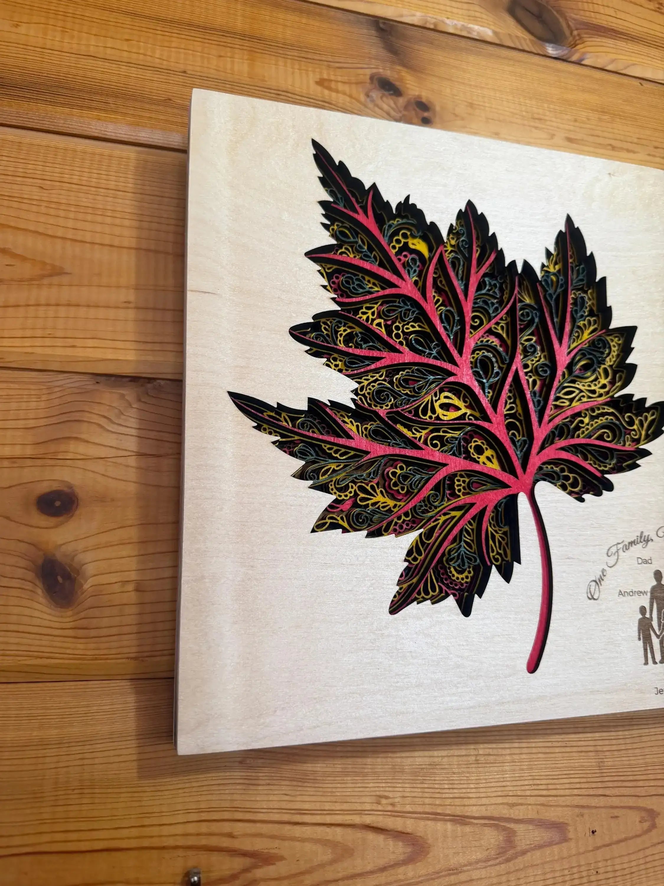 Layered wood art maple leaf with intricate mandala patterns, handcrafted decor