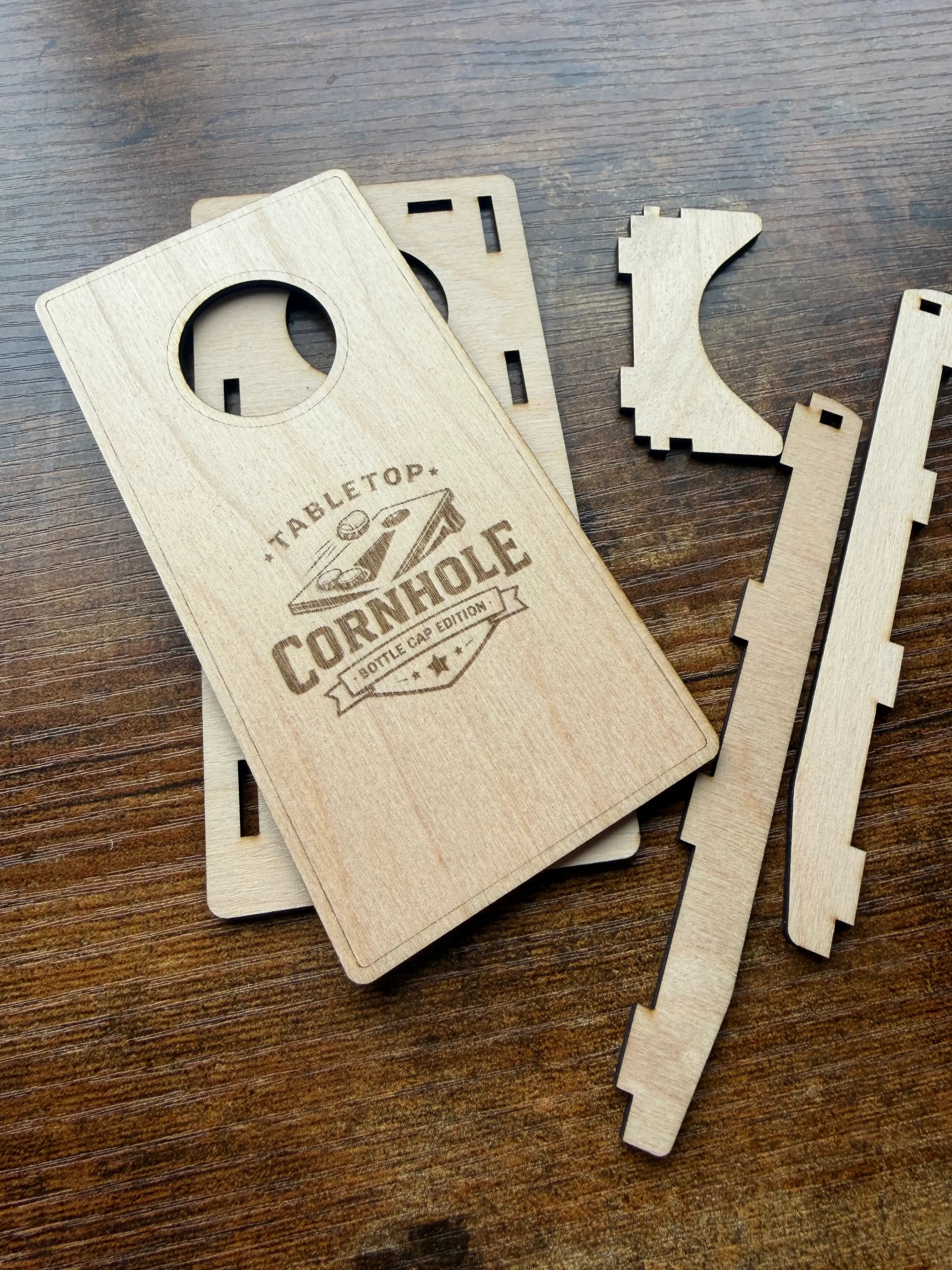 Tabletop Cornhole Bottle Cap Edition laser-cut wood game set on rustic table