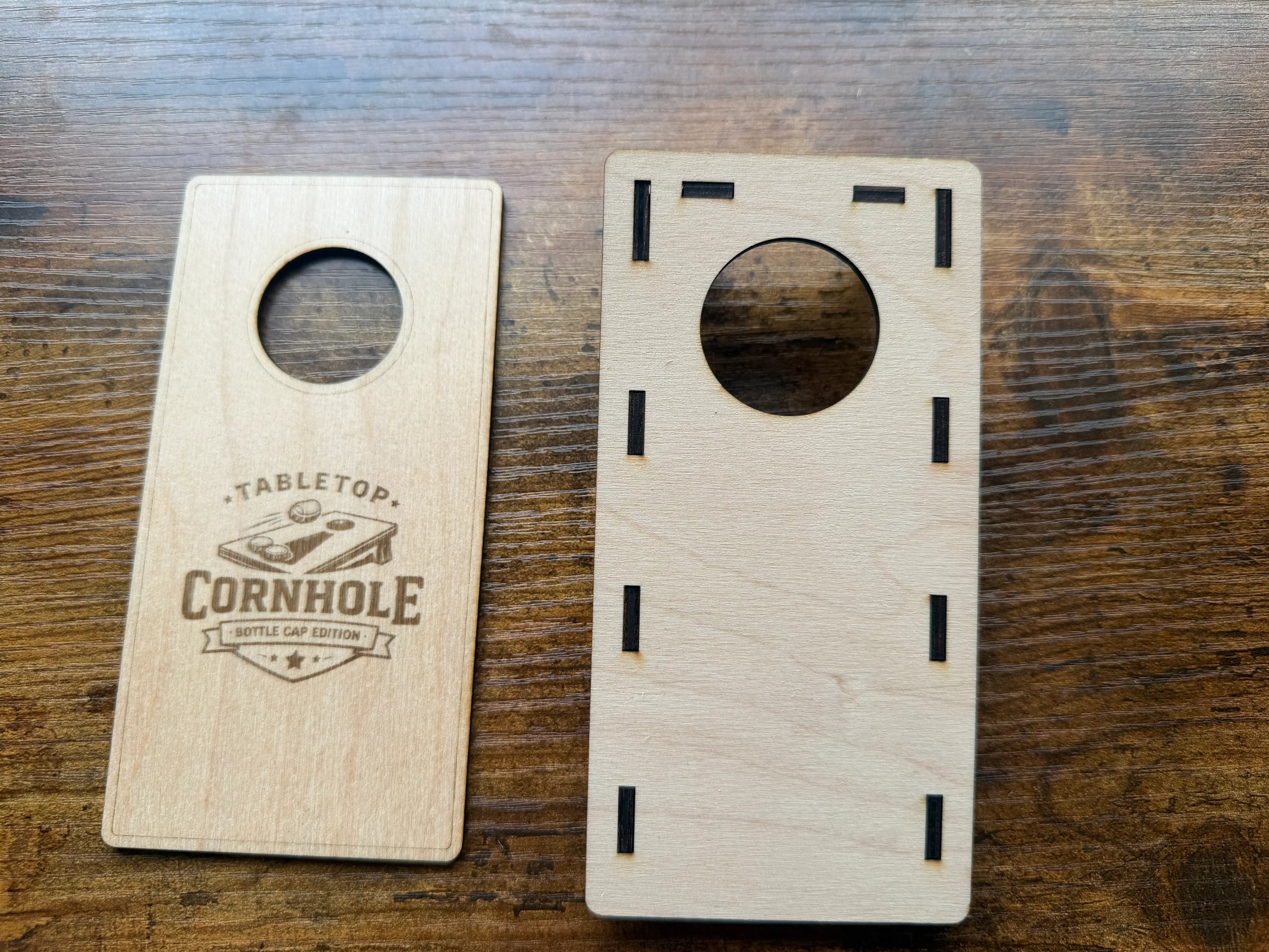 Tabletop cornhole game board, laser-cut wood with bottle cap edition design