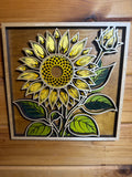 Layered wood sunflower art with vibrant yellow petals and green leaves, handcrafted decor piece