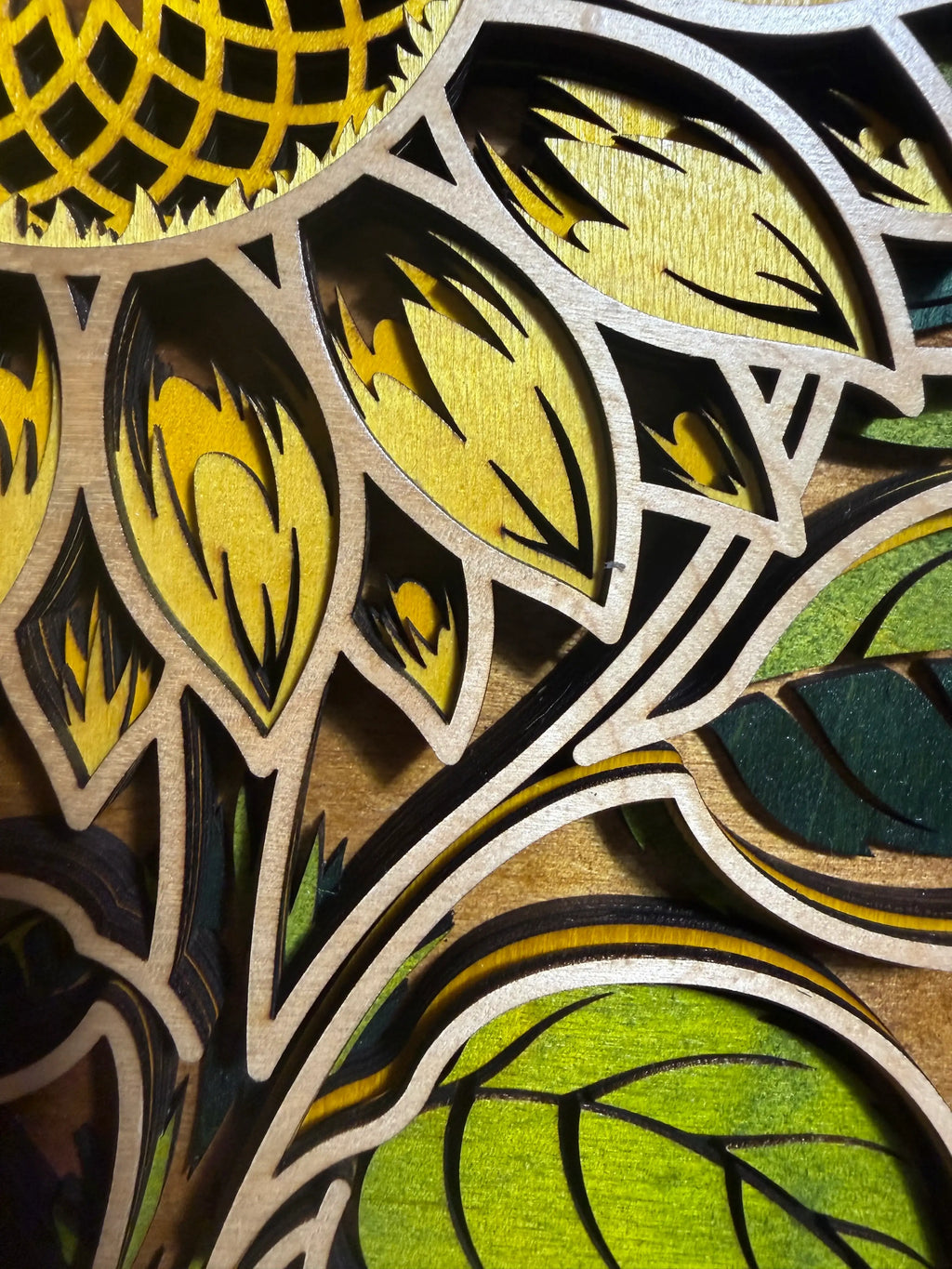 Layered wood sunflower art with laser-cut petals and green leaves, handmade decorative wall decor
