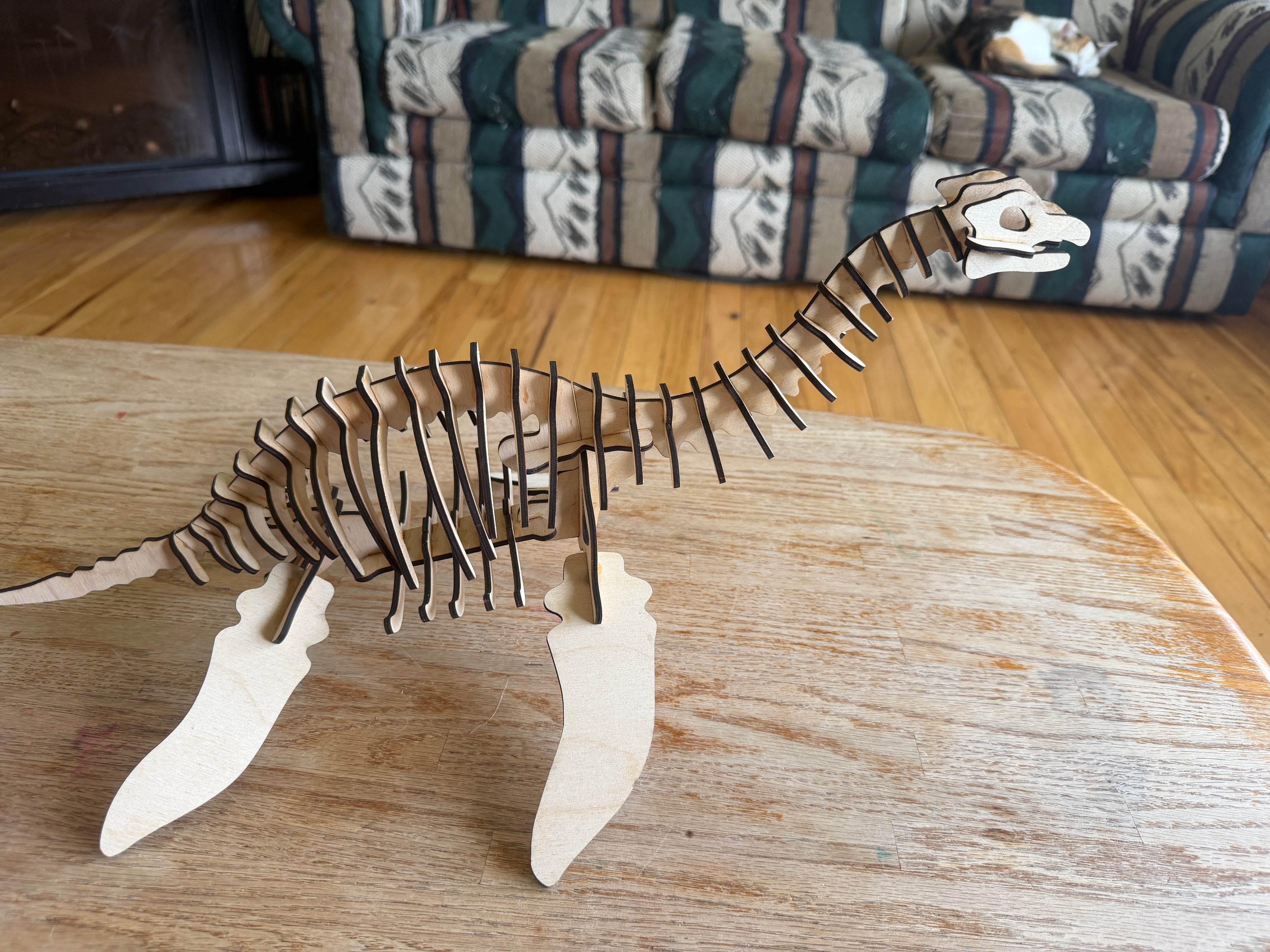 Handcrafted wooden dinosaur skeleton art, laser-cut layered decor for unique home styling