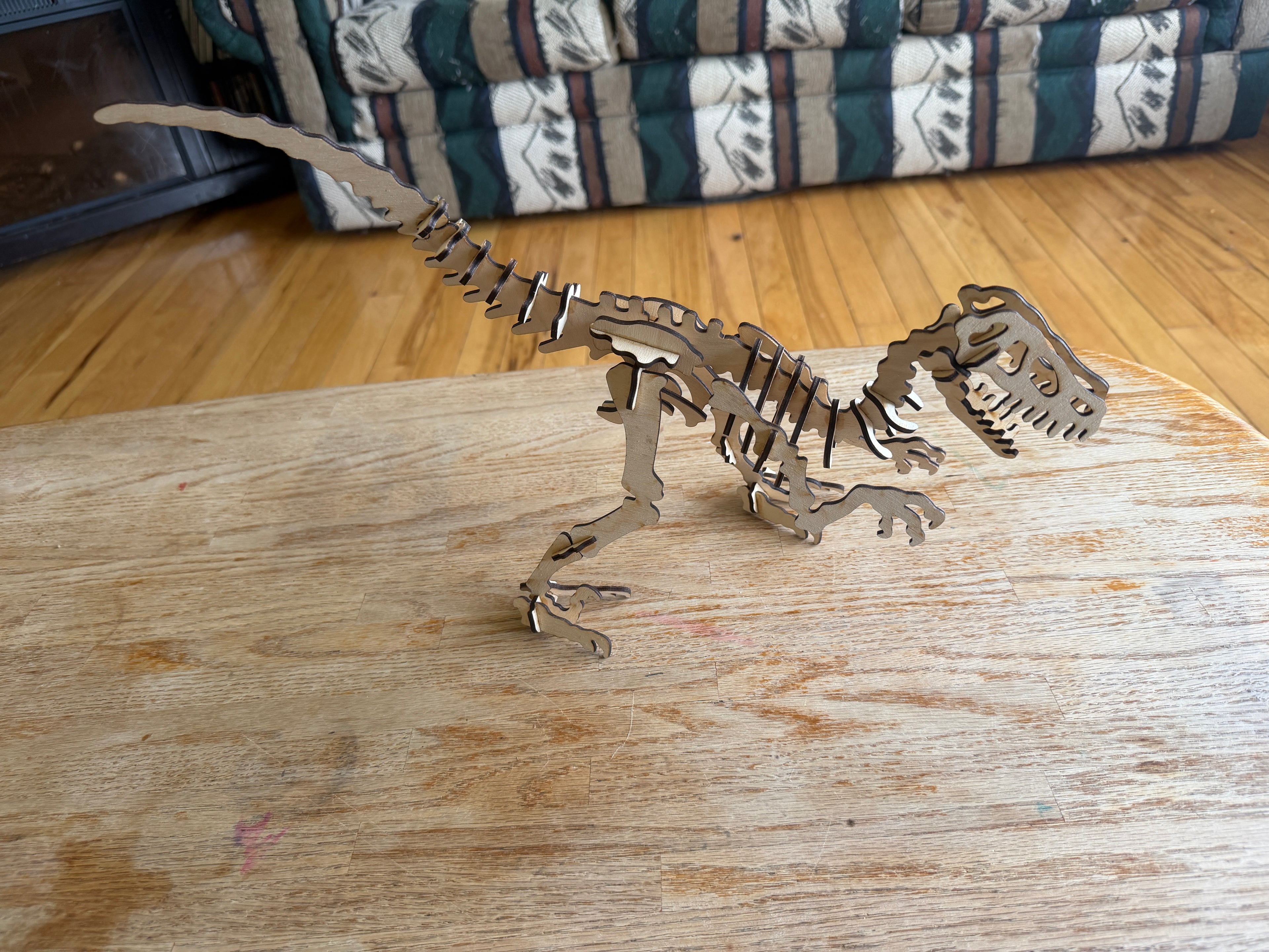 Handcrafted wooden T-Rex skeleton art, laser-cut layered wood decor for unique home styling