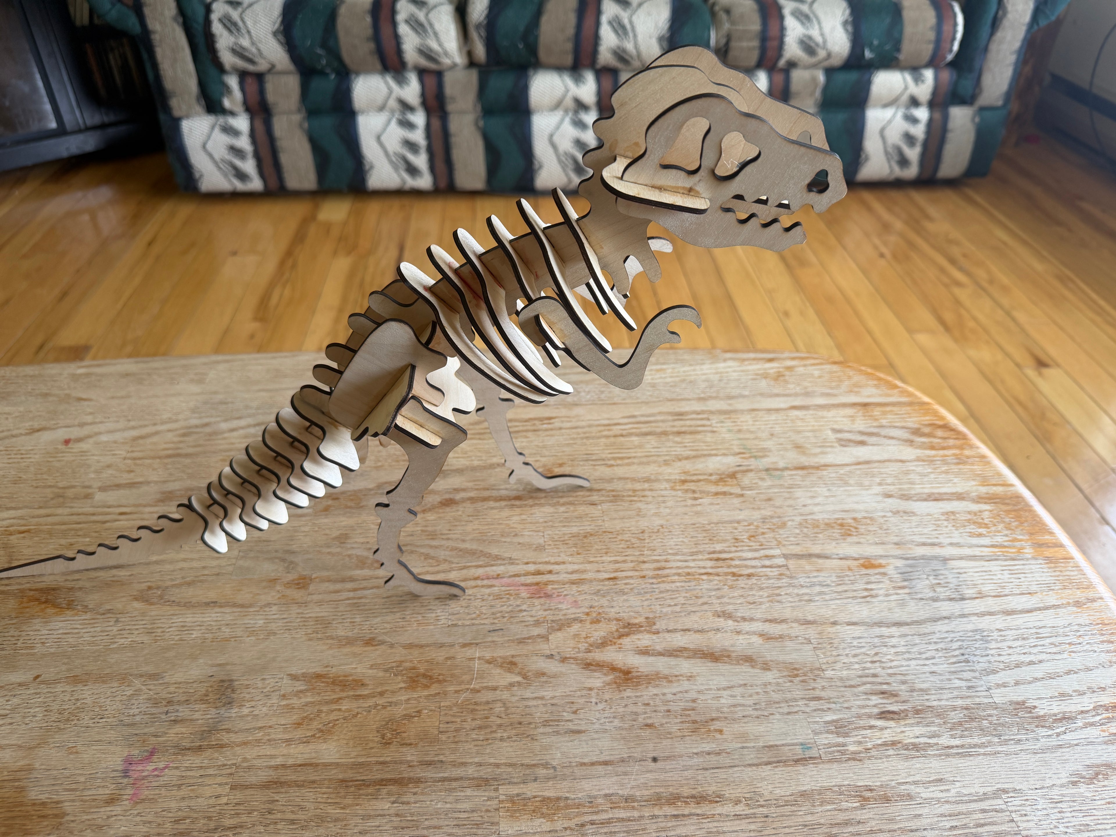 Handcrafted wooden T-Rex skeleton art, laser-cut layered decor for unique home styling