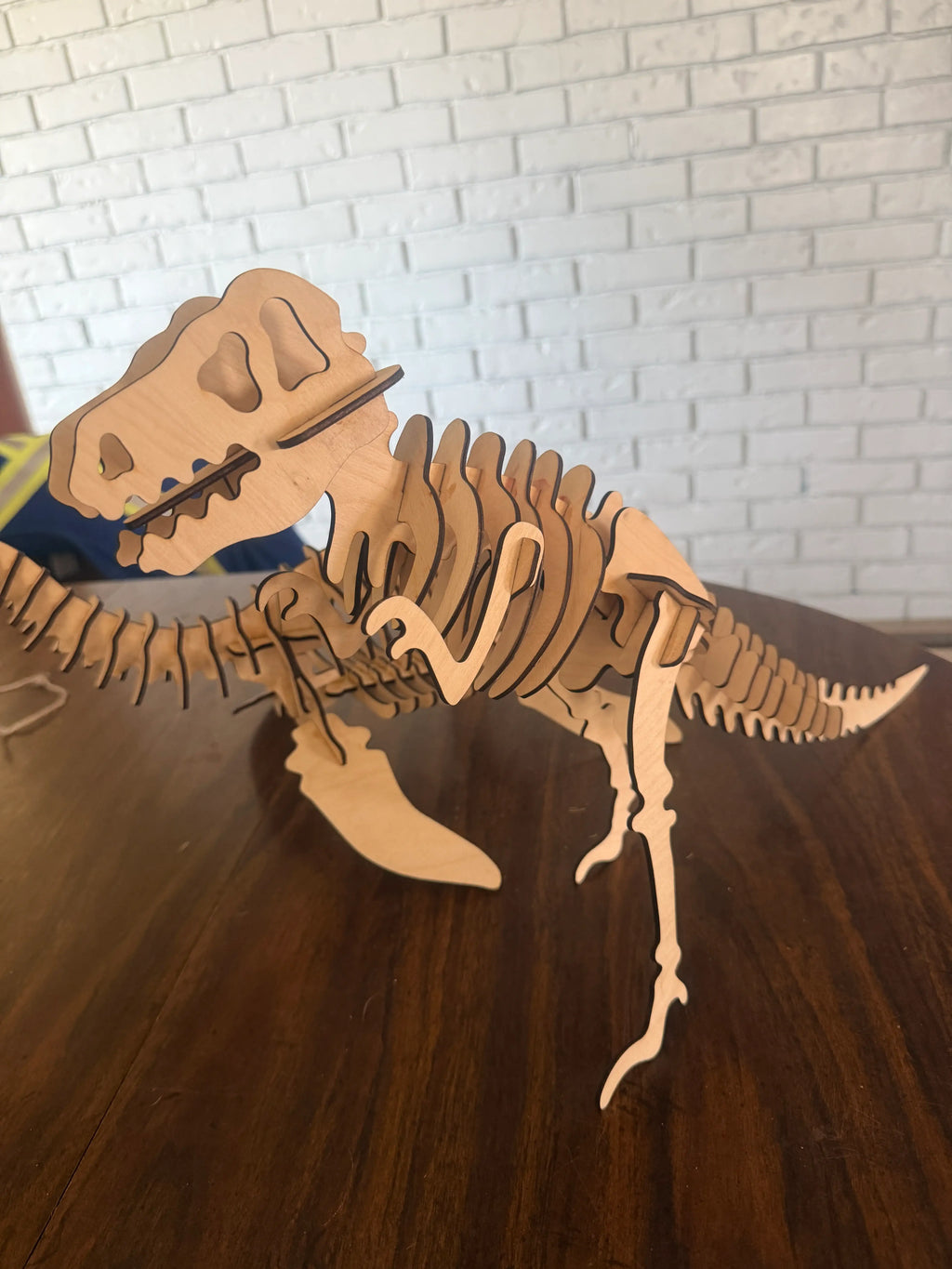 Handcrafted wooden T-Rex skeleton art, laser-cut layered wood decor for dinosaur enthusiasts
