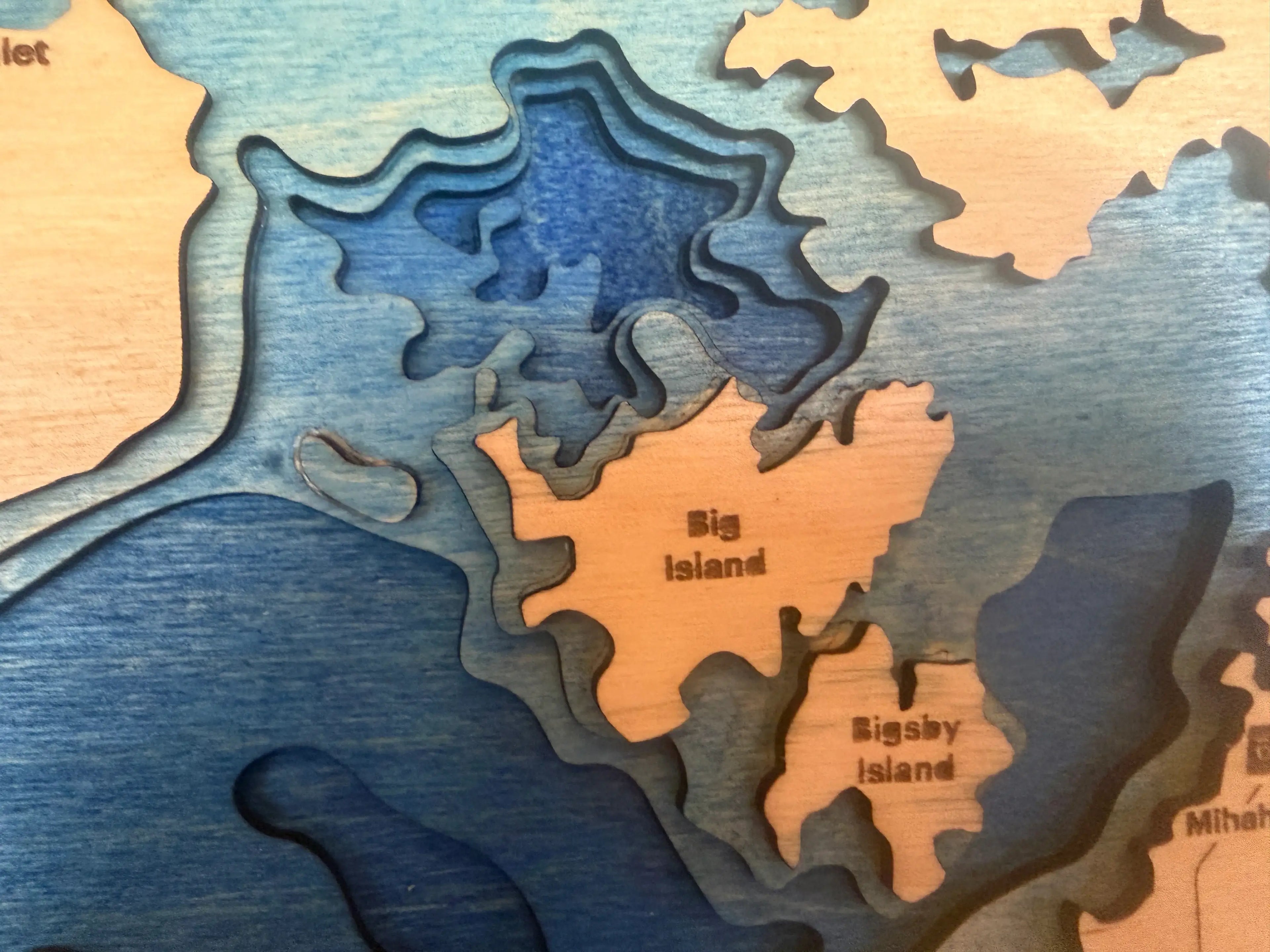 Layered wood lake map featuring Big Island and Bigsby Island, handcrafted decor with blue and natural wood tones.
