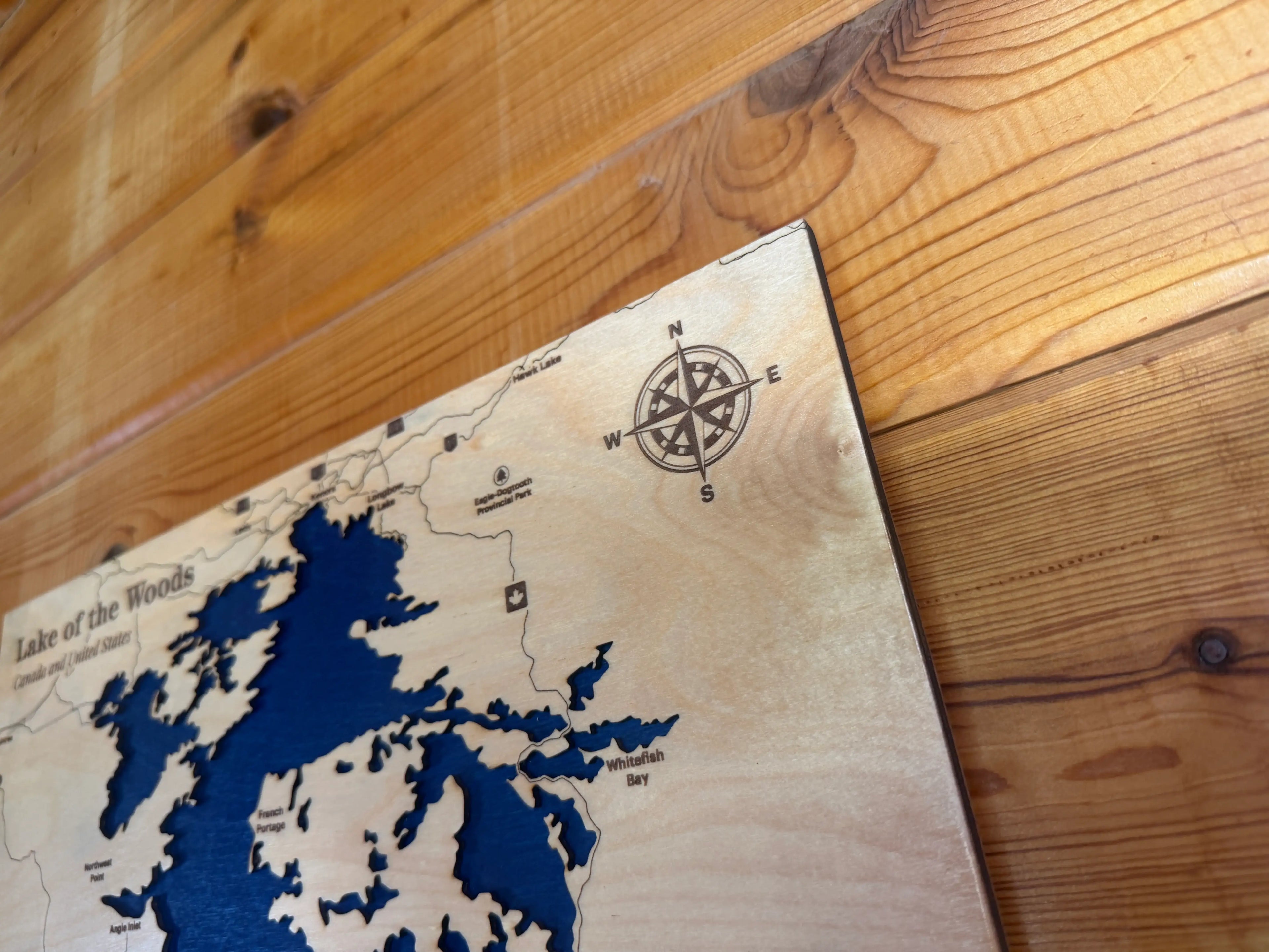 Layered wood map of Lake of the Woods with compass, laser-cut decor for rustic home