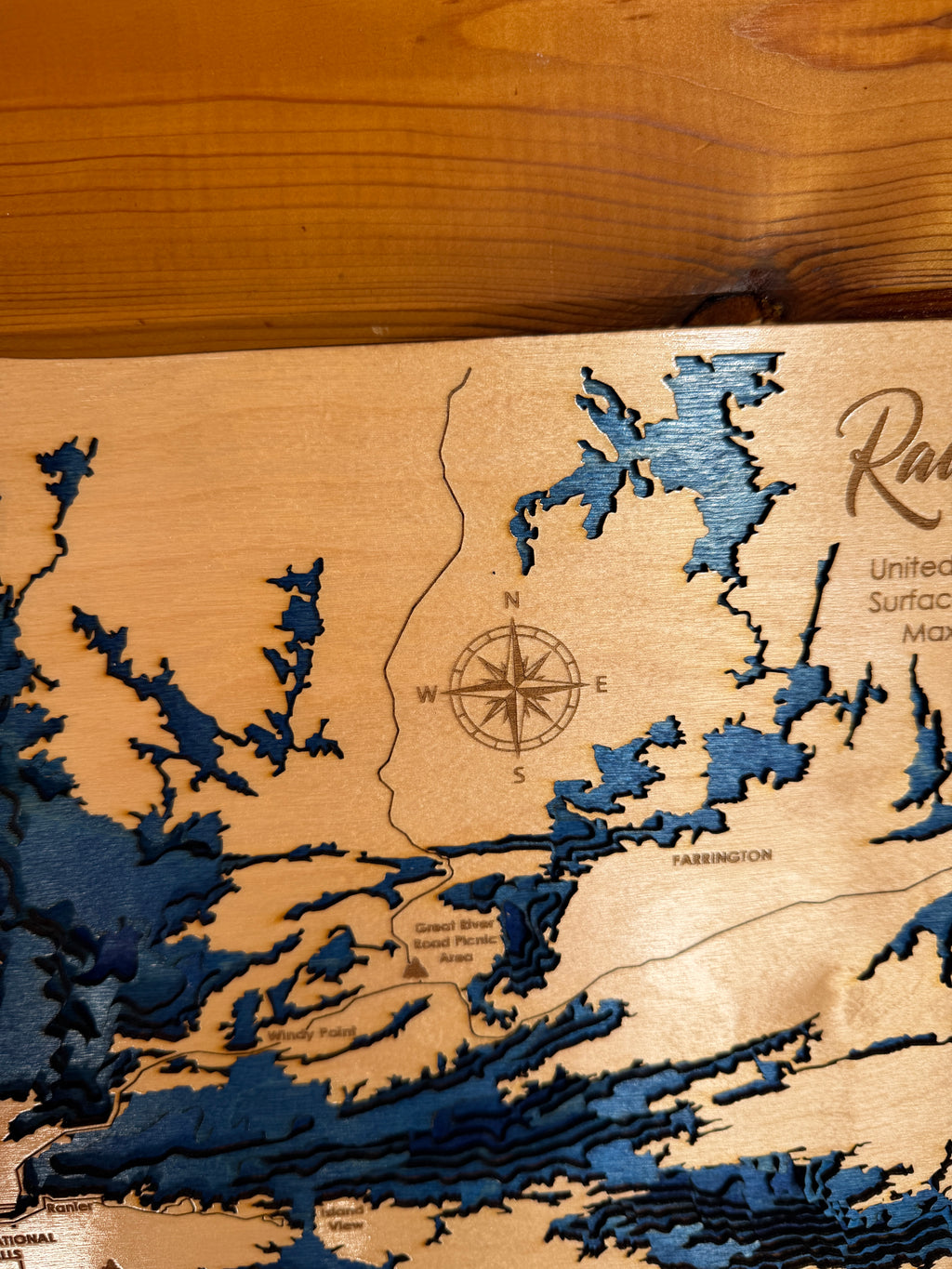Wooden map with topographic details on a wooden surface