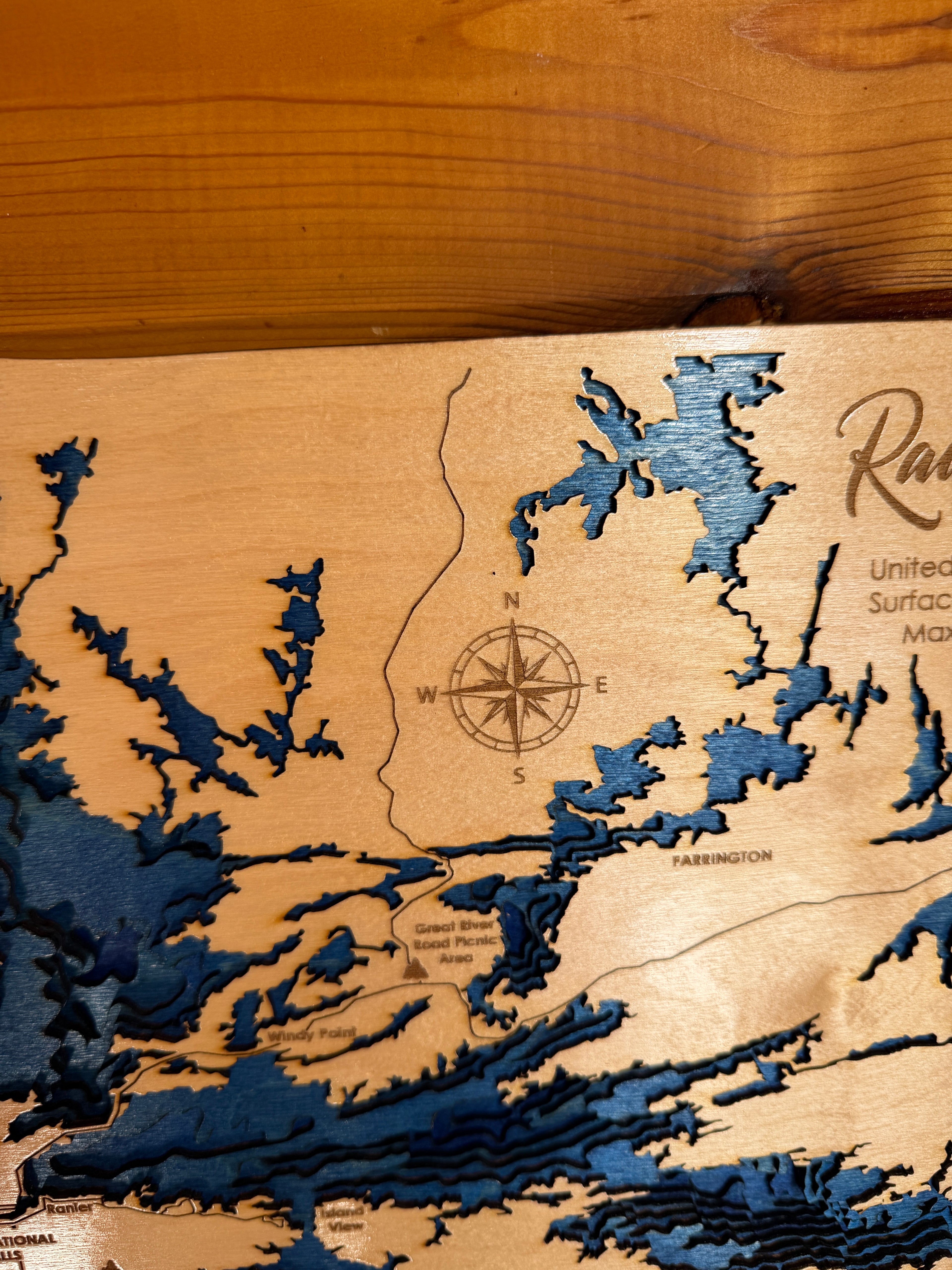 Wooden map with topographic details on a wooden surface