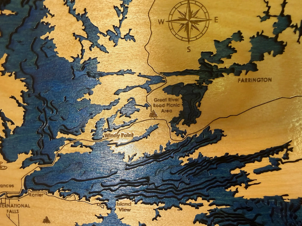 Handcrafted layered wood lake map with compass rose, showing Windy Point and Farrington, custom laser-cut decor