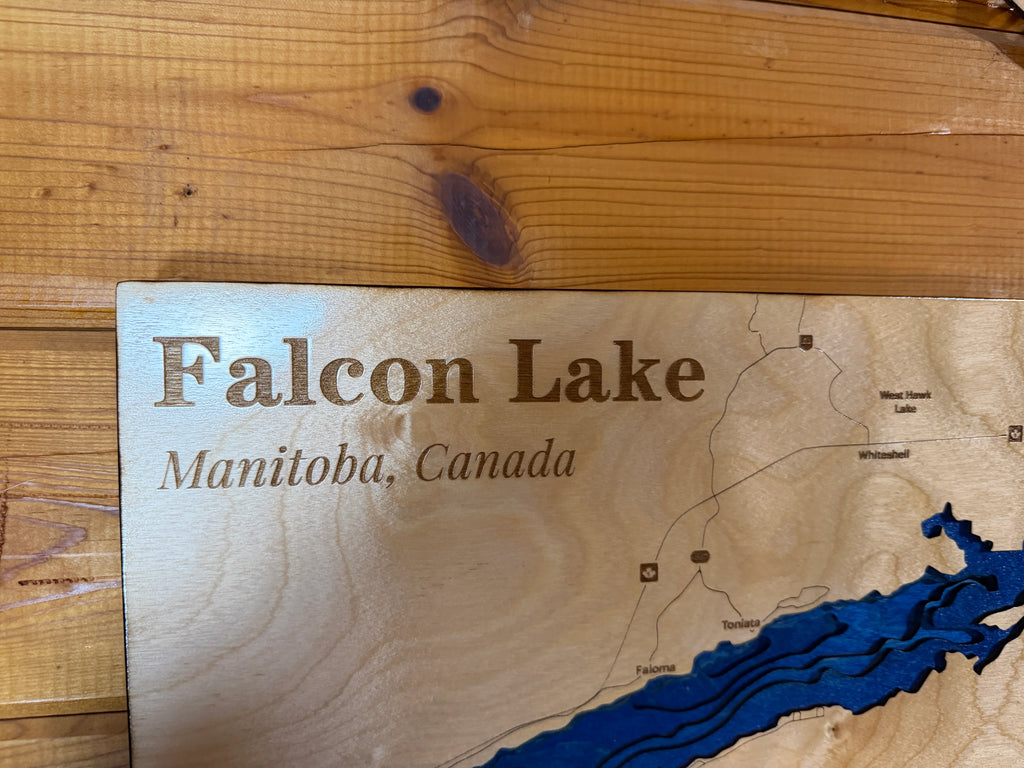 Handcrafted Falcon Lake Manitoba wood map with layered blue water, laser-cut lake decor for cabin or home.