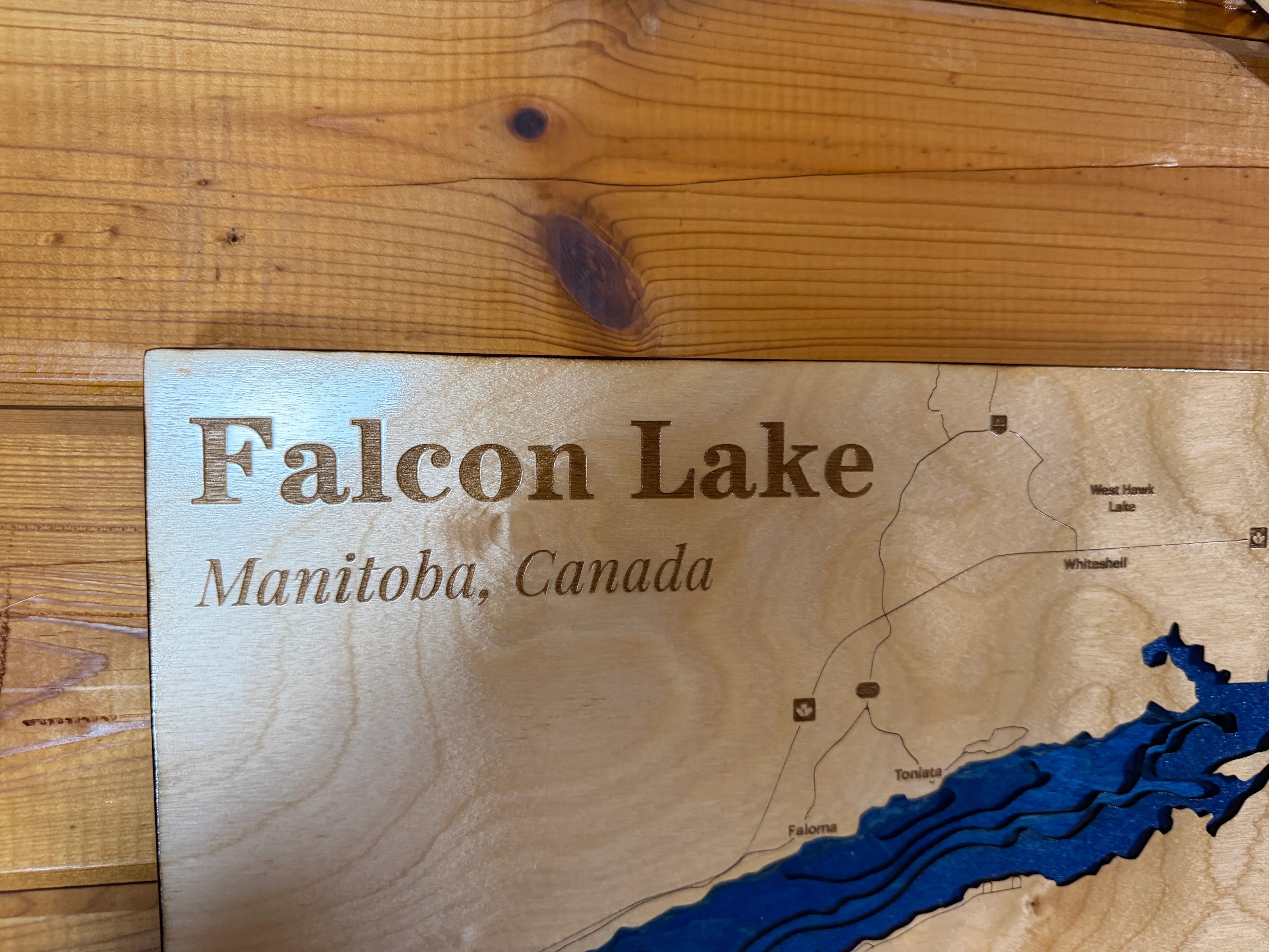 Handcrafted Falcon Lake Manitoba wood map with layered blue water, laser-cut lake decor for cabin or home.