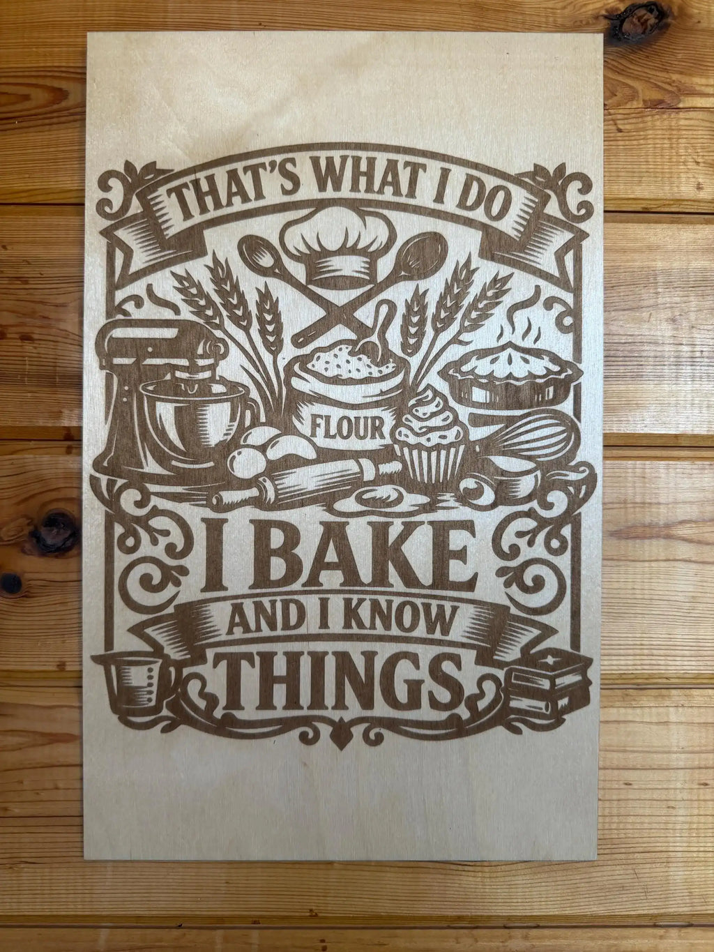 Laser-cut wooden sign with 'I bake and I know things' text, featuring baking tools and flour sack design