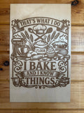 Laser-cut wooden sign with 'I bake and I know things' text, featuring baking tools and flour sack design