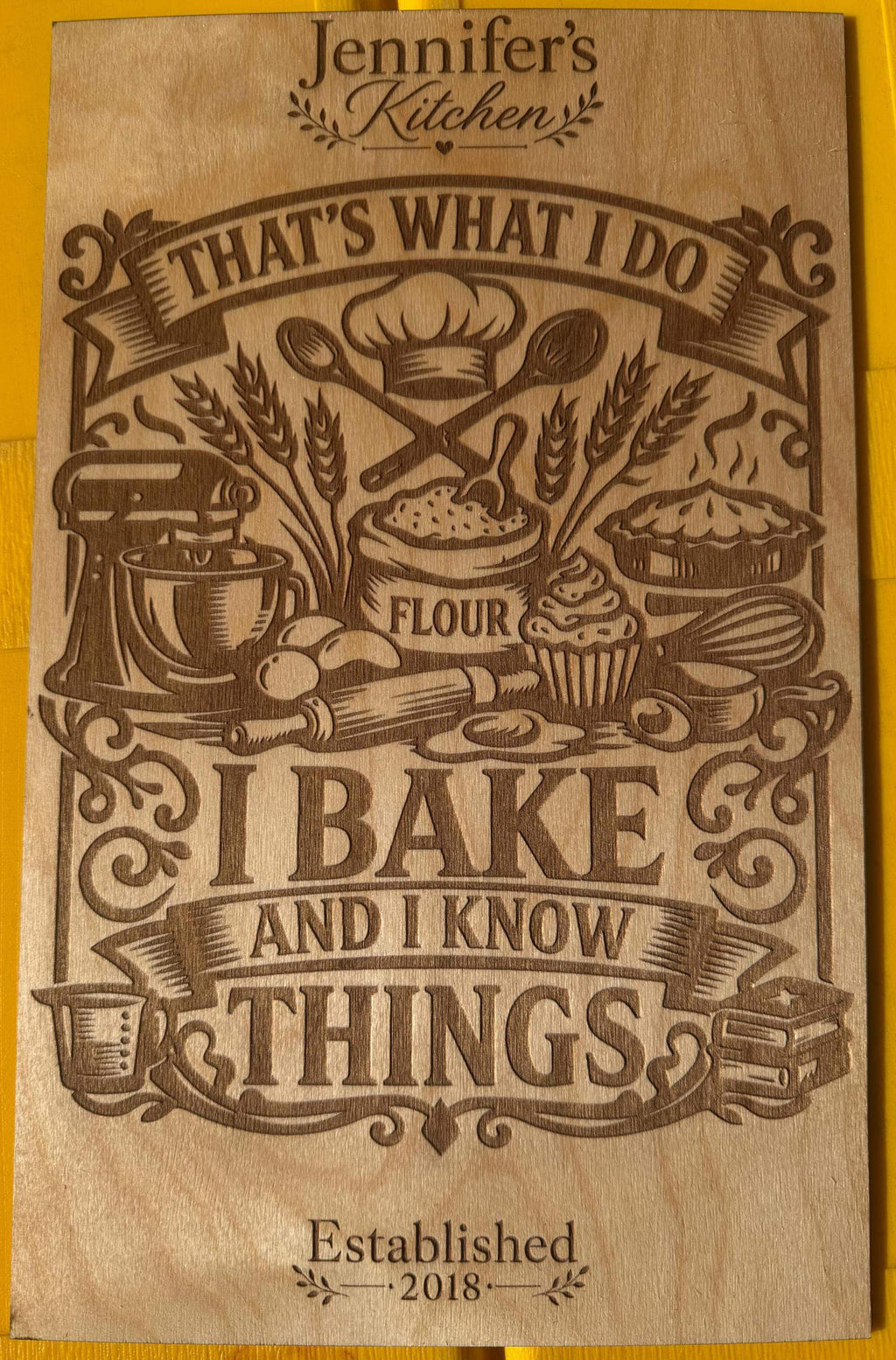 Custom laser-cut wooden sign with 'I Bake and I Know Things' and baking-themed designs