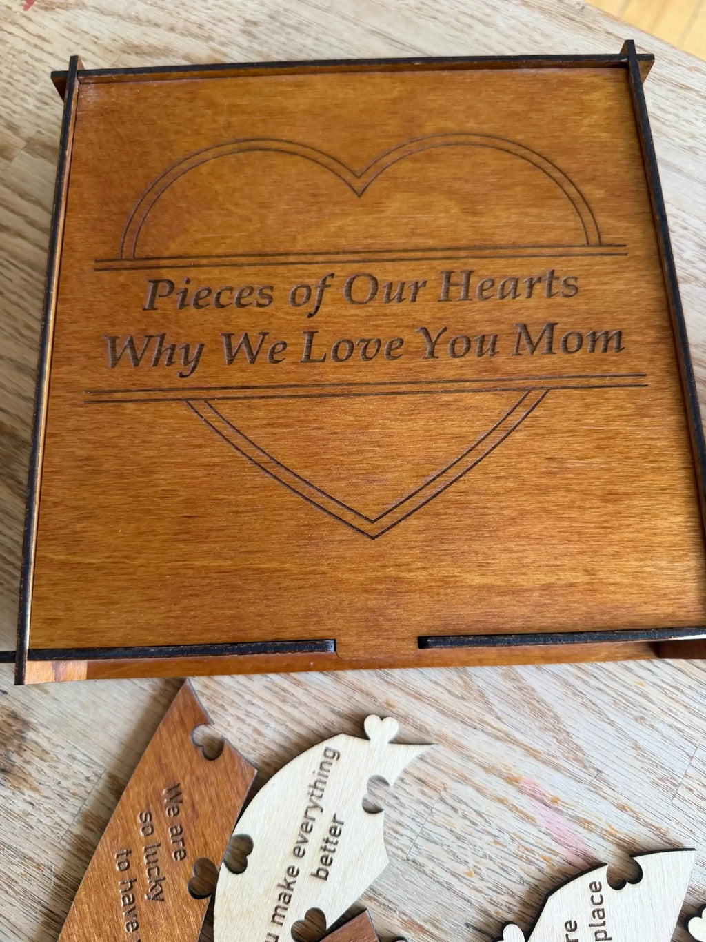 Engraved wooden heart puzzle, 'Pieces of Our Hearts Why We Love You Mom,' custom laser-cut decor
