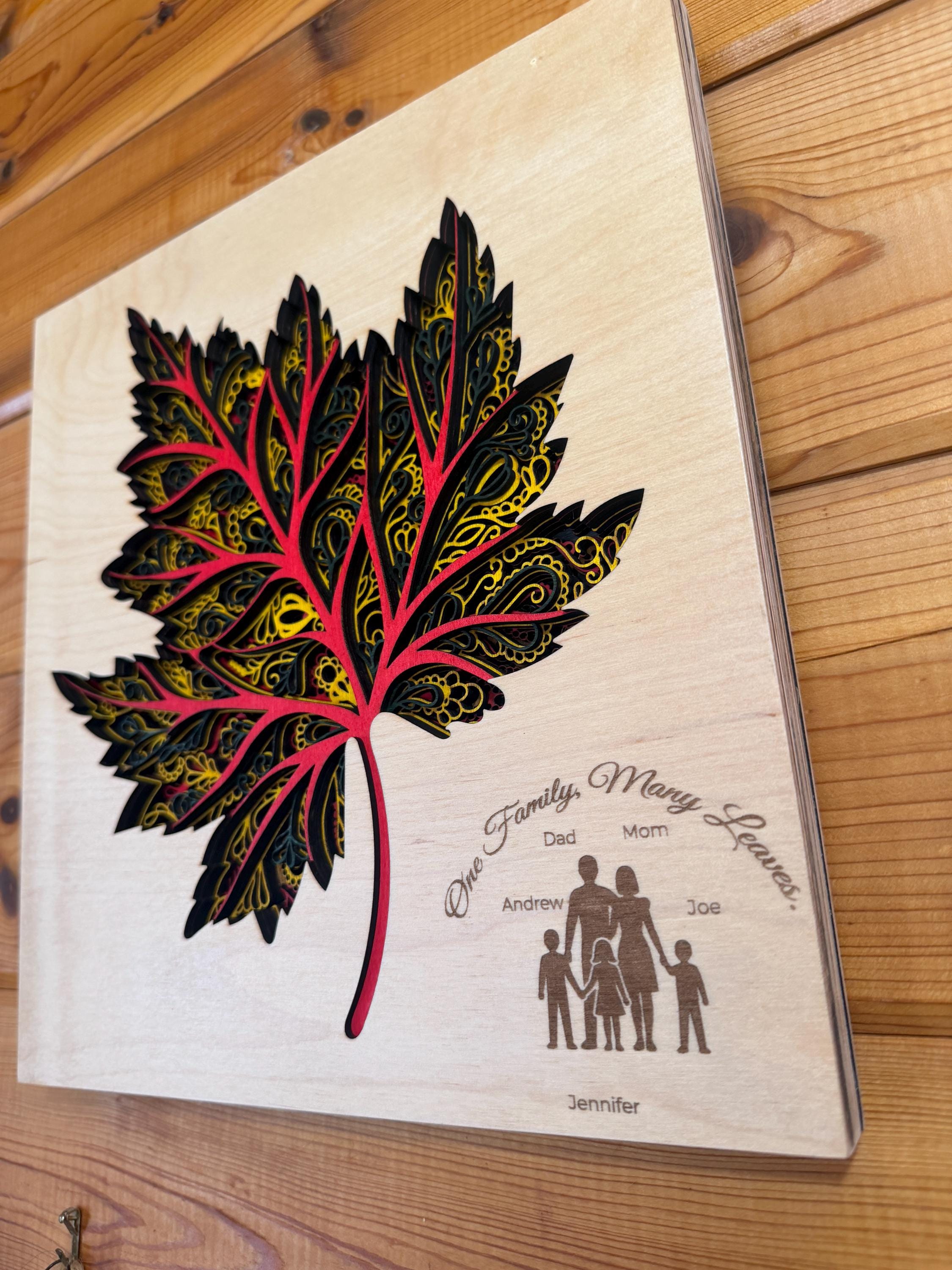 Layered wood maple leaf art with family names, laser-cut personalized decor for home