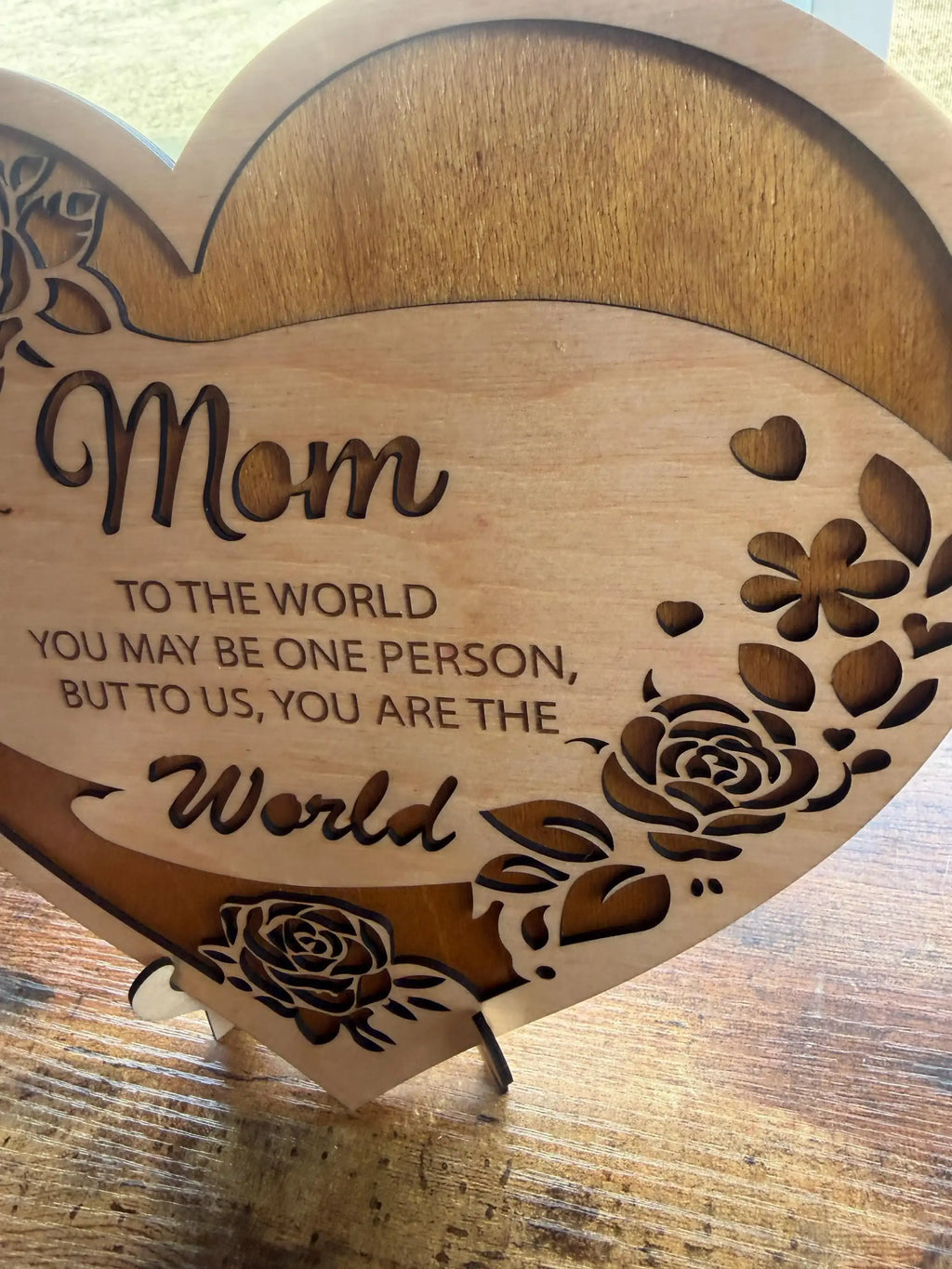 Handcrafted wooden heart sign for Mom with laser-cut roses and heartfelt quote, perfect Mother's Day decor