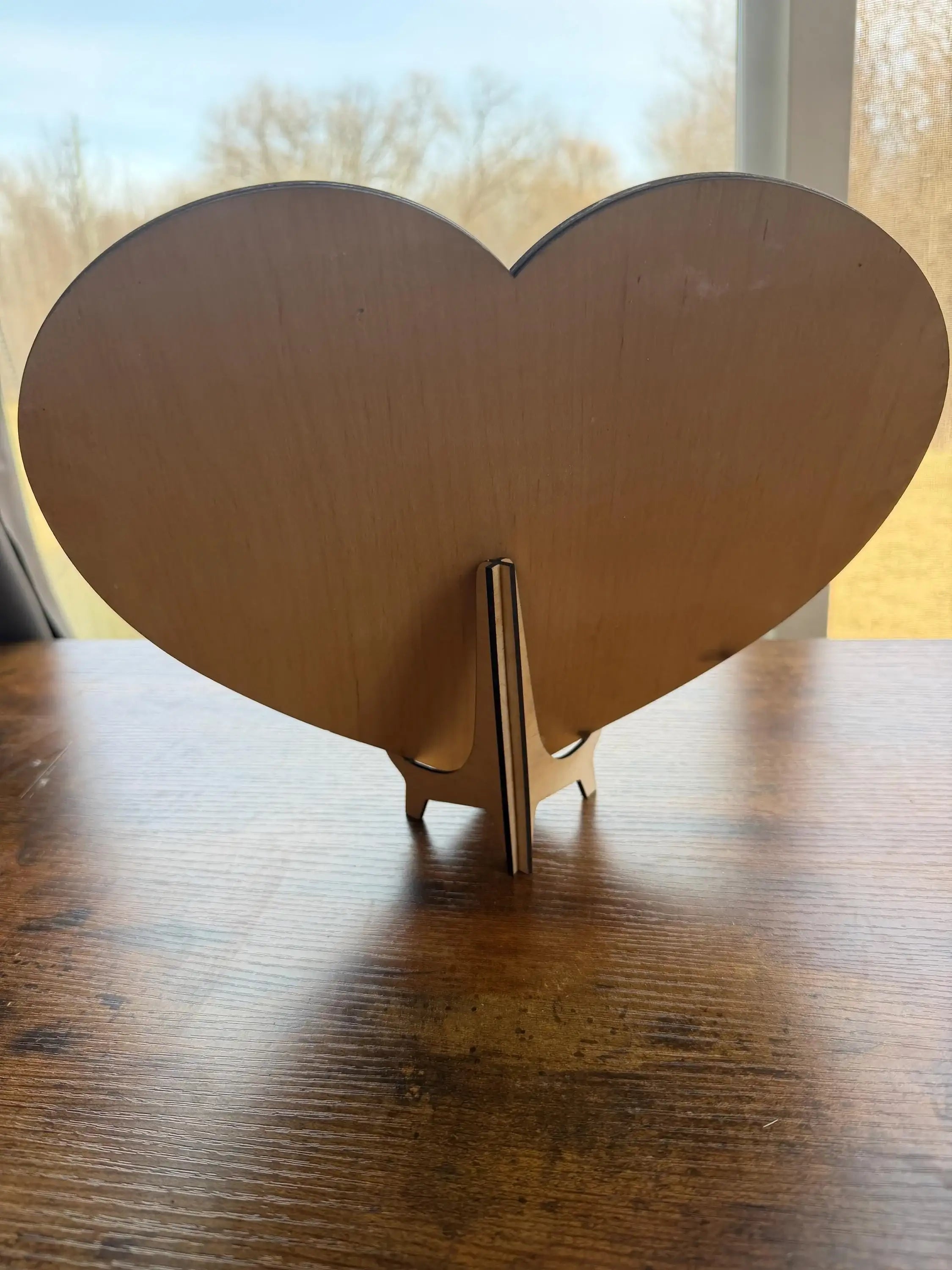 Handcrafted wooden heart decor with stand, perfect for rustic home styling