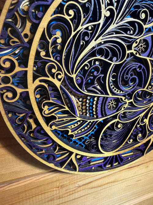 Intricate layered wood mandala with purple, blue, and gold swirls, laser-cut for unique wall decor.