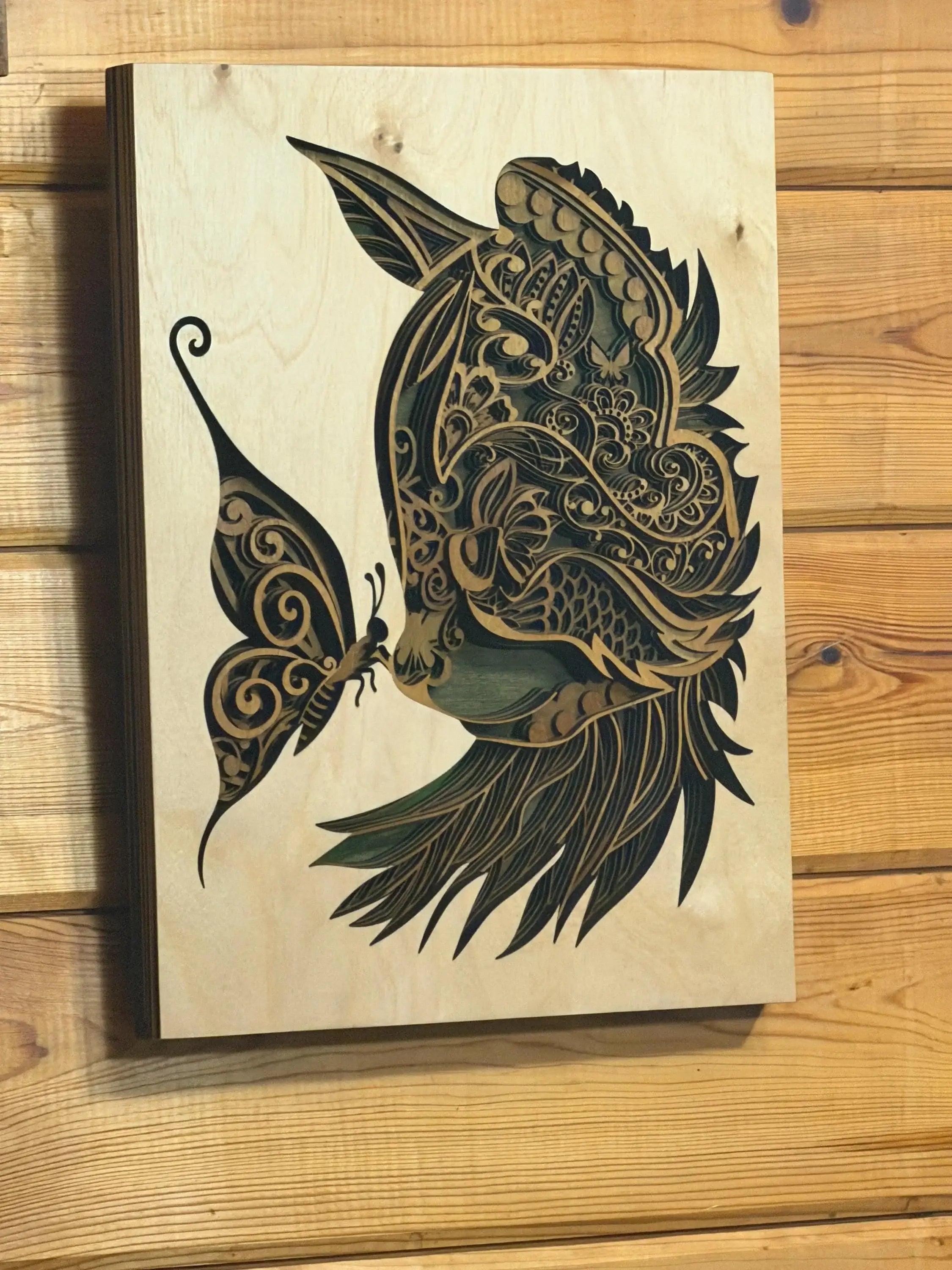 Layered wood art featuring intricate butterfly and floral mandala design, handcrafted wall decor