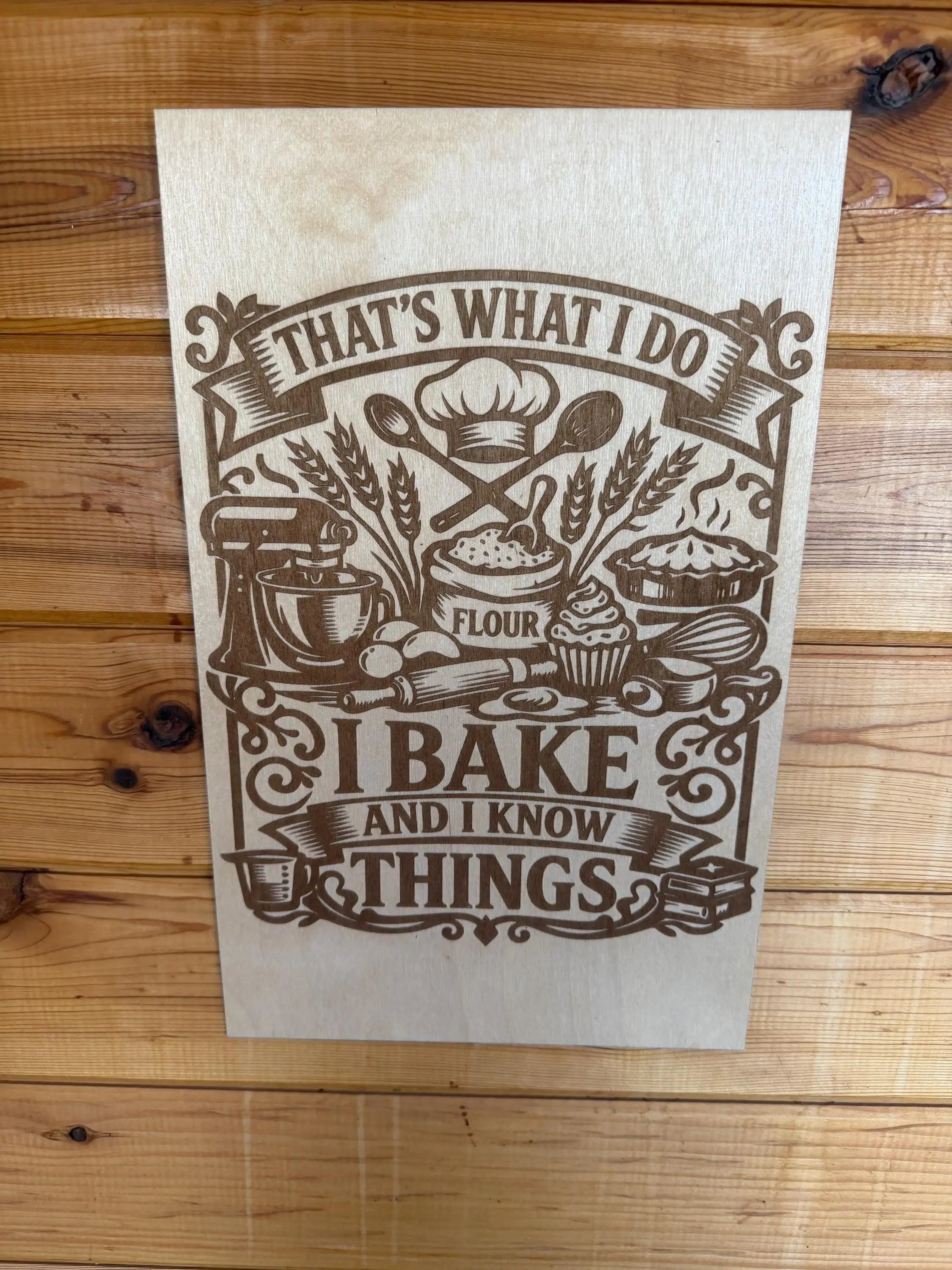 Laser-cut wood sign with 'I bake and I know things' quote, featuring baking tools and flour design