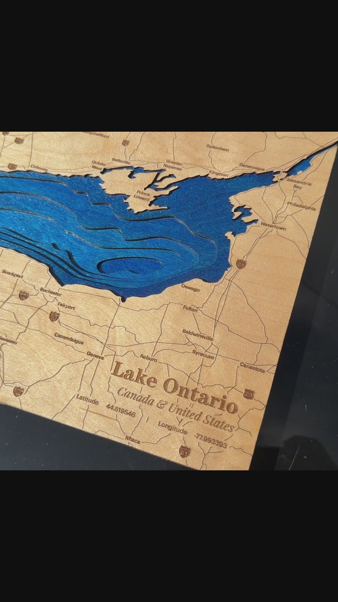 Lake ontario layered wood map with blue dye water layers